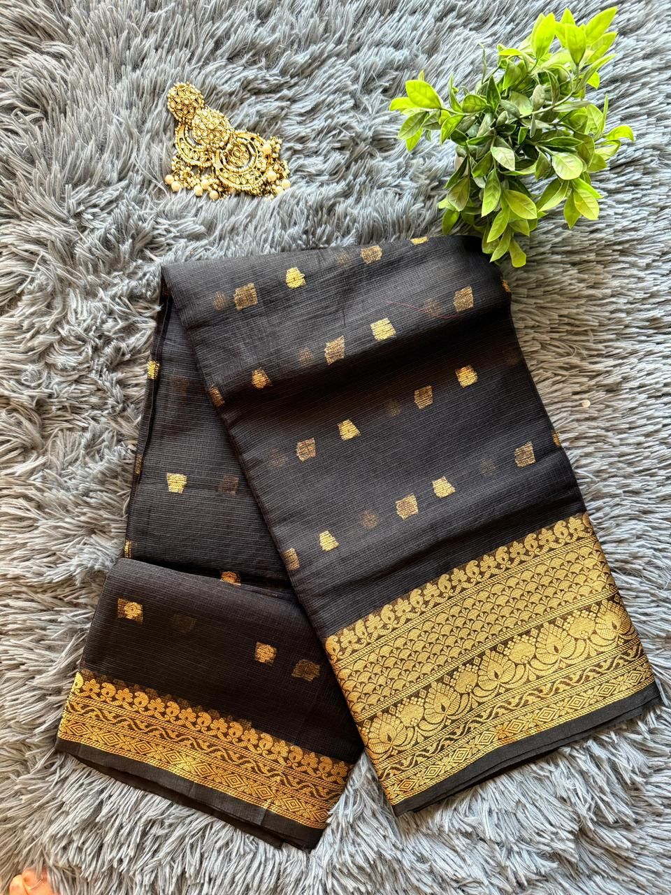 Midnight black Kota Doria saree with golden zari geometric motifs and ornate border